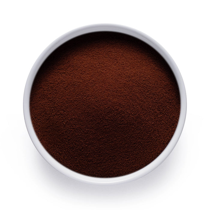 Dolce Superfoods instant chicory root powder in white bowl on white background