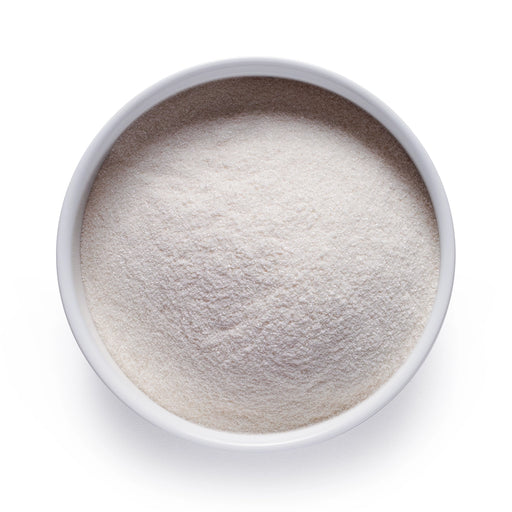 Dolce Superfoods L-theanine powder in white bowl on white background