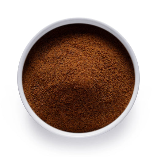 Dolce Superfoods organic acerola cherry powder in white bowl on white background