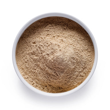 Dolce Superfoods organic ashwagandha root powder in white bowl on white background