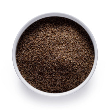 Dolce Superfoods organic chia seed powder in white bowl on white background