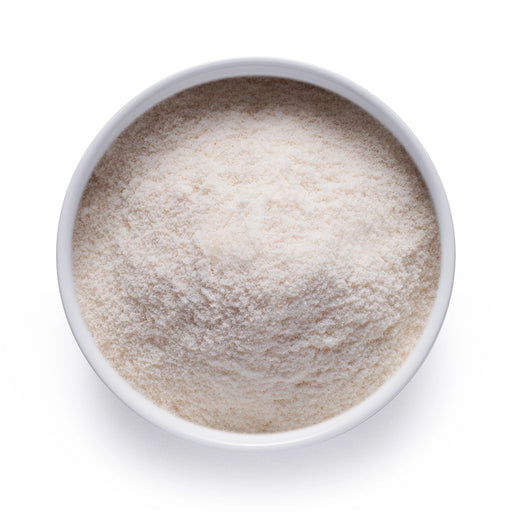 Dolce Superfoods coconut water powder in white bowl on white background