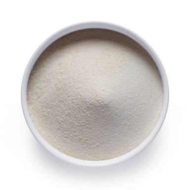 Dolce Superfoods collagen powder in white bowl on white background