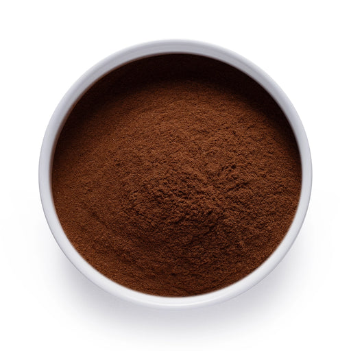 Dolce Superfoods organic Ceylon cinnamon powder in white bowl on white background