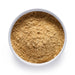 Dolce Superfoods organic ginger powder in white bowl on white background