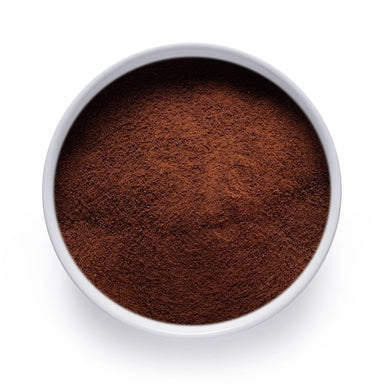 Dolce Superfoods organic instant coffee powder in white bowl on white background