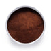 Dolce Superfoods organic instant coffee powder in white bowl on white background