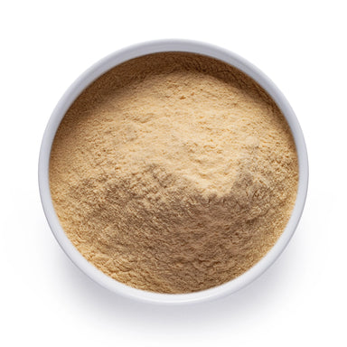 Dolce Superfoods organic banana powder in white bowl on white background