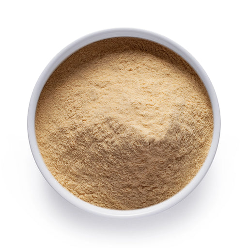 Dolce Superfoods organic banana powder in white bowl on white background