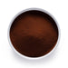 Dolce Superfoods organic instant black tea powder in white bowl on white background