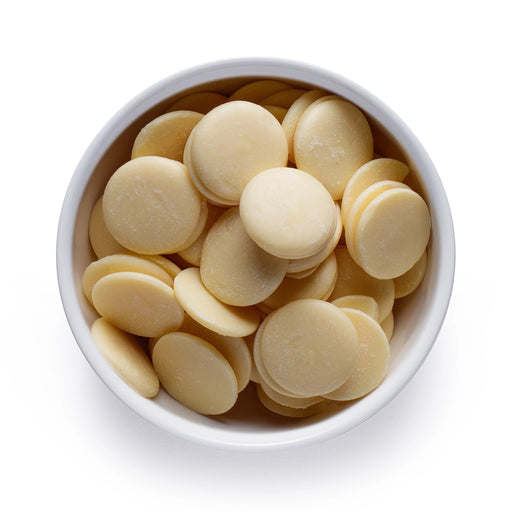 Dolce Superfoods organic cacao butter wafers in white bowl on white background