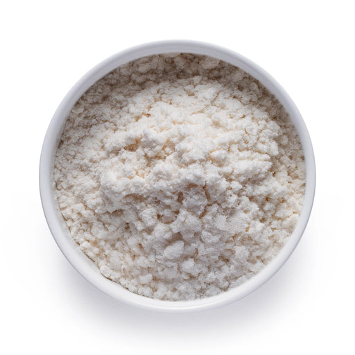 Dolce Superfoods organic MCT oil powder in white bowl on white background