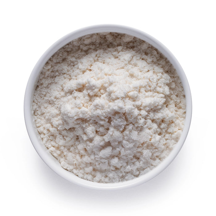 Dolce Superfoods organic MCT oil powder in white bowl on white background