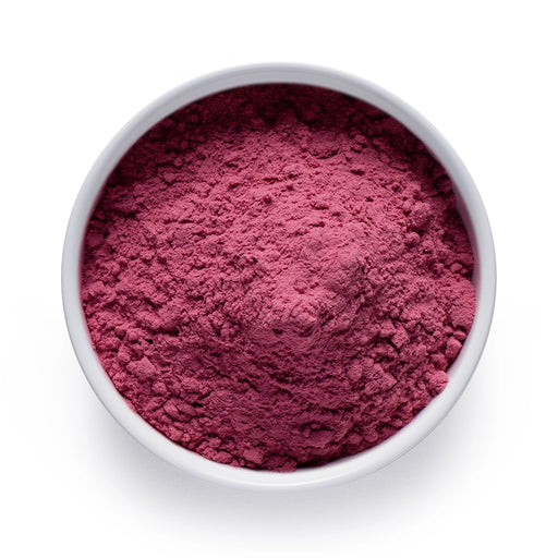 Dolce Superfoods organic red tart cherry powder in white bowl on white background