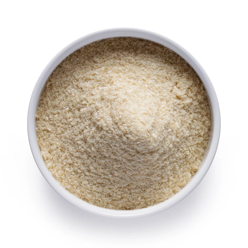 Dolce Superfoods tocotrienols powder in white bowl on white background