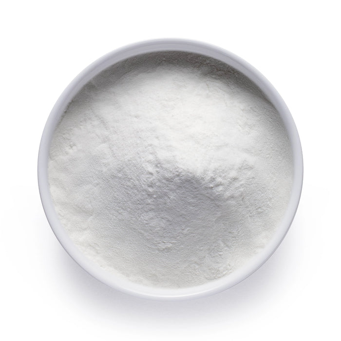 Dolce Superfoods marine magnesium powder in white bowl on white background