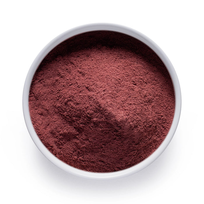 Dolce Superfoods organic beetroot powder in white bowl on white background