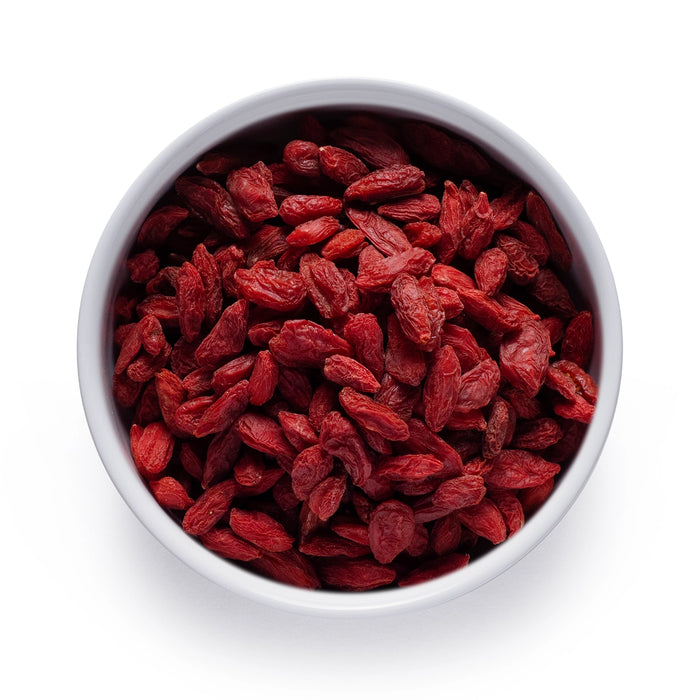 Dolce Superfoods organic dried goji berries in white bowl on white background