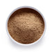 Dolce Superfoods organic maca root powder in white bowl on white background