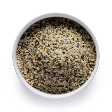 Dolce Superfoods organic hemp seeds in white bowl on white background