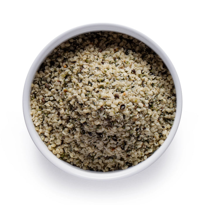 Dolce Superfoods organic hemp seeds in white bowl on white background