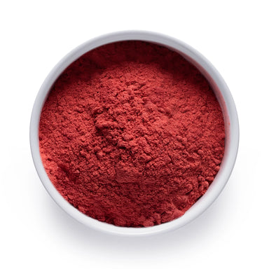 Dolce Superfoods organic strawberry powder in white bowl on white background