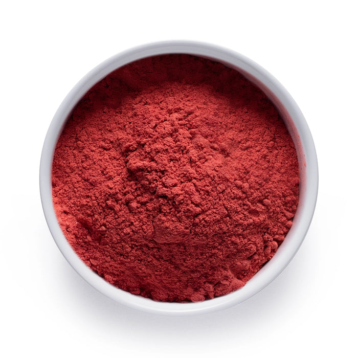 Dolce Superfoods organic strawberry powder in white bowl on white background