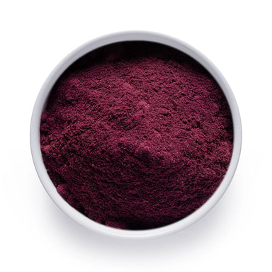 Dolce Superfoods organic blueberry powder in white bowl on white background