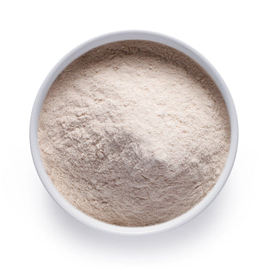 Dolce Superfoods psyllium husk powder in white bowl on white background