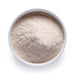 Dolce Superfoods psyllium husk powder in white bowl on white background
