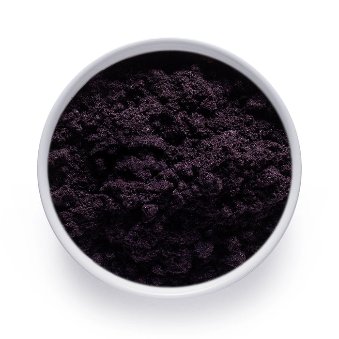 Dolce Superfoods organic acai powder in white bowl on white background