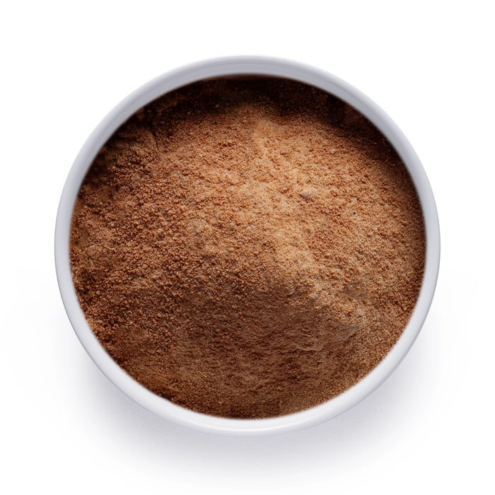 Dolce Superfoods organic coconut sugar in white bowl on white background