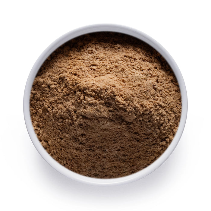 Dolce Superfoods maitake mushroom powder in white bowl on white background