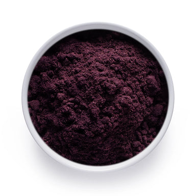 Dolce Superfoods organic maqui powder in white bowl on white background