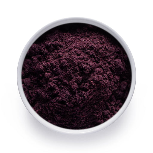 Dolce Superfoods organic maqui powder in white bowl on white background