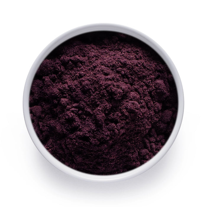 Dolce Superfoods organic maqui powder in white bowl on white background