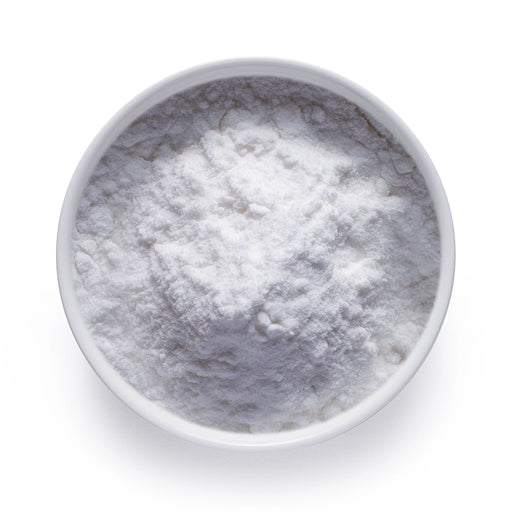 Bulk organic coconut milk powder in a white bowl, fine white dairy-free powder for wholesale beverage and recipe applications.