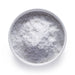 Bulk organic coconut milk powder in a white bowl, fine white dairy-free powder for wholesale beverage and recipe applications.