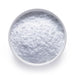 Bulk organic creatine monohydrate powder in a white bowl, fine white micronized powder for wholesale supply