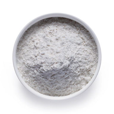 Bulk vanilla extract powder in a white ceramic bowl, wholesale superfood ingredient by Dolce Superfoods