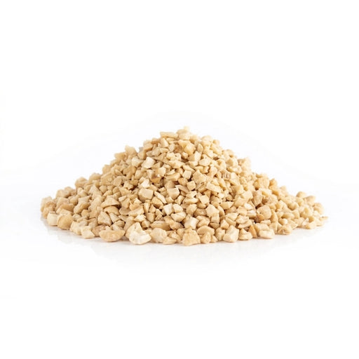 Pile of diced cashew pieces on white background – Dolce Superfoods bulk wholesale ingredient