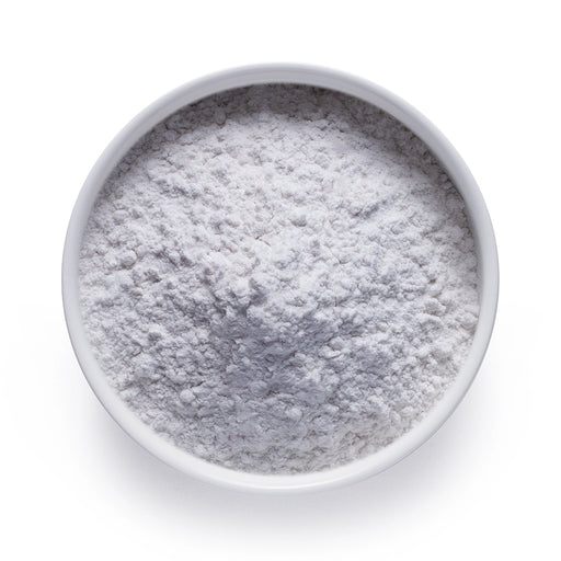 Bulk melatonin powder in a white ceramic bowl, wholesale superfood ingredient by Dolce Superfoods