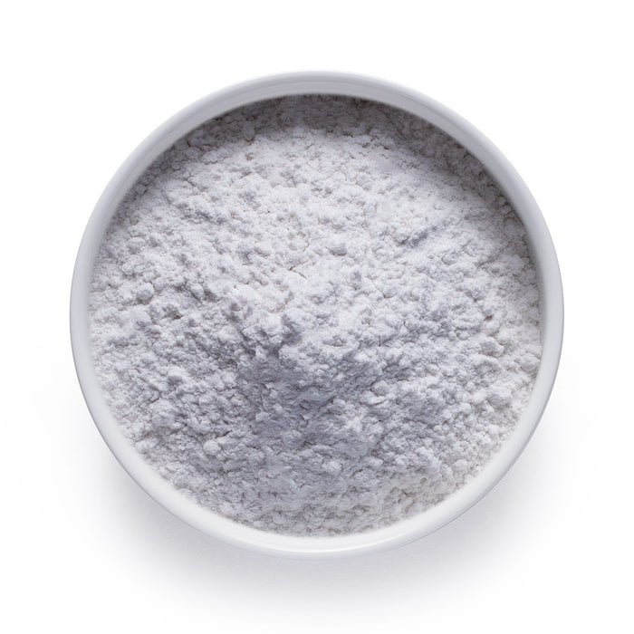 Bulk melatonin powder in a white ceramic bowl, wholesale superfood ingredient by Dolce Superfoods