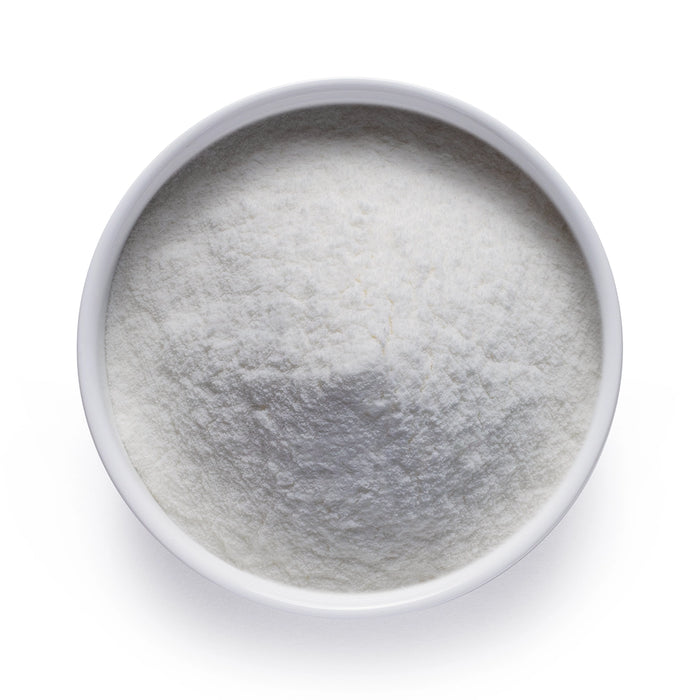 Bulk organic lemon powder in a white ceramic bowl, wholesale superfood ingredient by Dolce Superfoods