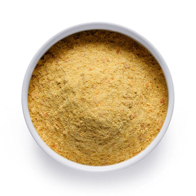 Bulk organic nutritional yeast in a white ceramic bowl, wholesale superfood ingredient by Dolce Superfoods