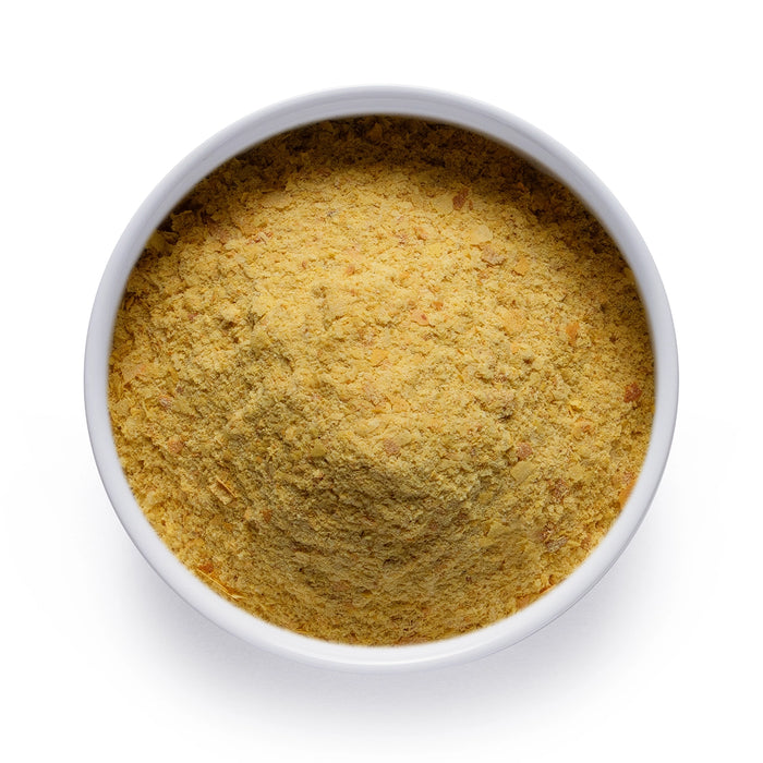 Bulk organic nutritional yeast in a white ceramic bowl, wholesale superfood ingredient by Dolce Superfoods