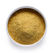 Bulk organic nutritional yeast in a white ceramic bowl, wholesale superfood ingredient by Dolce Superfoods