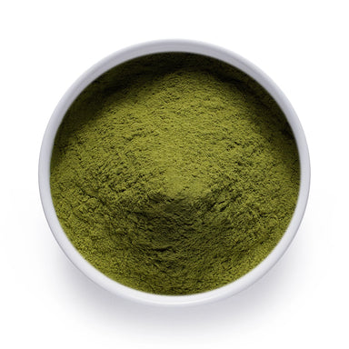 Bulk organic spinach powder in a white ceramic bowl, wholesale superfood ingredient by Dolce Superfoods