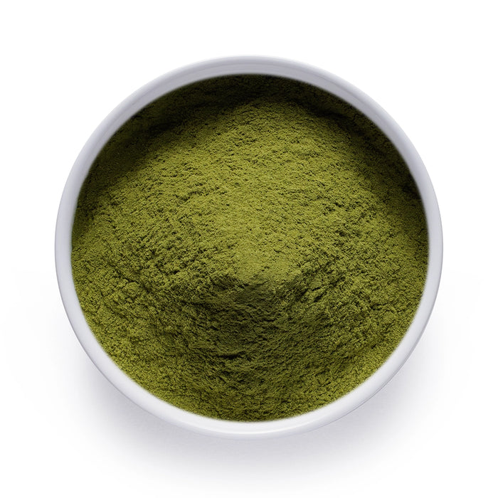 Bulk organic spinach powder in a white ceramic bowl, wholesale superfood ingredient by Dolce Superfoods