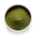 Bulk organic spinach powder in a white ceramic bowl, wholesale superfood ingredient by Dolce Superfoods